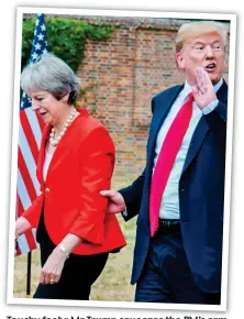  ??  ?? Touchy feely: Mr Trump squeezes the PM’s arm