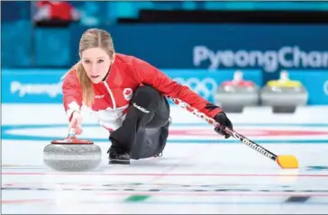  ?? WANG ZHAO/AFP ?? Canada’s Kaitlyn Lawes competes in the curling mixed doubles round robin session against South Korea at the Pyeongchan­g 2018 Winter Olympic Games today.