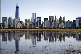  ?? MEL EVANS — THE ASSOCIATED PRESS FILE ?? New York's Lower Manhattan skyline, including the One World Trade Center, left, is seen from Liberty State Park in Jersey City, N.J.