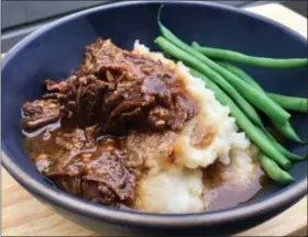  ?? PHOTO COURTESY OF A LITTLE YUMMINESS ?? Made in the oven or slow cooker, these tangy, orange-infused short ribs may just be the ultimate cozy winter supper.