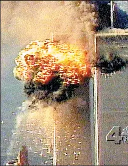  ??  ?? Smoke and fire surround the upper floors of the World Trade Center in New York City after a second plane crashed into one of the buildings.