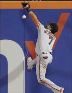  ??  ?? San Francisco Giants center fielder Gorkys Hernandez (7) attempts to catch a ball hit by New York Mets’ Jose Reyes for a triple during the eighth inning of a baseball game Tuesday in New York. (AP Photo/Frank Franklin II). AP PHOTO/MICHEL EULER