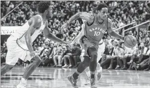  ?? CP PHOTO ?? Toronto Raptors’ guard DeMar DeRozan goes to the basket against the Miami Heat during NBA action Tuesday night in Toronto.