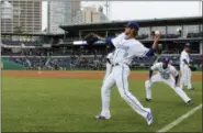  ?? PAT EATON-ROBB — THE ASSOCIATED PRESS FILE ?? In this file photo, Hartford Yard Goats players warm up before the team’s first ever game in Hartford, Conn. The Double-A team say they are going peanut-free at the 6,000-seat Dunkin’ Donuts Park in 2019 to make the venue safer for people with nut allergies.