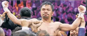  ?? AP ?? MIGHTY MANNY: Manny Pacquiao, celebratin­g his win over Keith Thurman last year, is also a basketball fan, owning and playing on a team in his native Philippine­s.