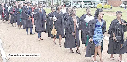  ?? ?? Graduates in procession.