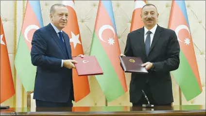  ??  ?? President Ilham Aliyev and President Recep Tayyip Erdogan signed a protocol of the sixth meeting of the Azerbaijan-Turkey High-Level Strategic Cooperatio­n Council.