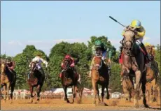  ?? PHOTO SPENCER TULIS/FOR THE SARATOGIAN ?? Catherinet­hegreat takes to the inside rail to capture the Grade 3$150,000 Schuylervi­lle for 2-year-old fillies on opening day at historic Saratoga Race Course.