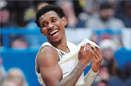  ?? JESSICA HILL/AP PHOTO ?? UConn senior Christian Vital is all smiles during the Huskies’ 81-65 win over Central Florida on Feb. 26 in Hartford.