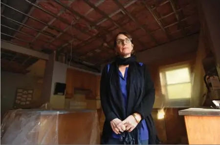  ?? PETER LEE, RECORD STAFF ?? Kelly Walberg, fundraisin­g and office co-ordinator at Marillac Place, stands inside the kitchen at the home. The kitchen is one of the rooms being repaired after extensive water damage forced expecting and new moms out of the home.