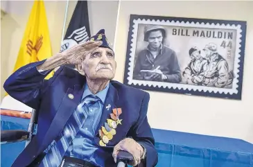  ?? ROBERTO E. ROSALES/JOURNAL ?? World War II veteran and Bataan Death March survivor Joe Romero salutes New Mexico National Guard Adjutant General Kenneth Nava after Nava presented him with military service medals in Albuquerqu­e on Saturday.