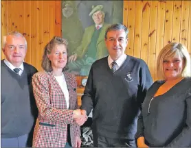  ??  ?? Lady Noble shakes hands with Skye Camanachd chairman Douglas MacDougall below a portrait of Sir Iain Noble. They are flanked by Skye Camanachd’s committee member Donnie Martin and Marion Gillies, who is involved with Skye Camanachd Ladies.