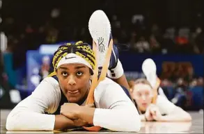  ?? Eric Gay / Associated Press ?? UConn’s Aaliyah Edwards stretches during a practice session on Saturday in Minneapoli­s.