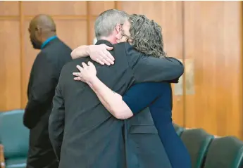  ?? MONICA CABRERA/THE MORNING CALL PHOTOS ?? Gavin P. Holihan and his wife, Nancy, embrace Tuesday after he was sworn in as Lehigh County district attorney at the Lehigh County Courthouse in Allentown.