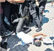  ??  ?? Turkish police scuffled with crowds trying to get into the Hagia Sophia, which returned to its use as a mosque for Friday prayers after nearly 90 years