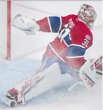  ?? GRAHAM HUGHES/THE CANADIAN PRESS ?? Montreal Canadiens goaltender Carey Price makes a save against the Ottawa Senators during second period NHL hockey action in Montreal on Sunday.