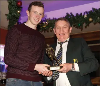  ??  ?? East Kerry Board Chairman Tim Ryan presenting the East Kerry O’Donoghue Cup final Man of the Match Award to Shane Ryan, Rathmore, at the reception in Scott’s Hotel, Killarney on Sunday.