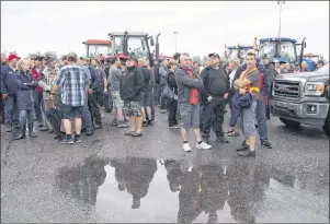  ?? JACQUES BOISSINOT/THE CANADIAN PRESS ?? Local dairy farmers protest protect the dairy supply management in Quebec using their tractors in Saguenay, Que., in this Aug. 25, 2016, file photo. Supply management: economists love to hate it, and Canadian farmers are loathe to give it up.