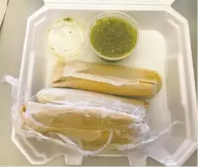  ?? STAFF PHOTOS BY BARRY COURTER ?? Diners at Mr. Burrito Grill choose their own ingredient­s such as black beans, rice, melted white cheese, grated Mexican cheese, spinach, chipotle chicken, sour cream and avocado in this hefty burrito, left. Tamales, right, come with a side of salsa verde.