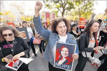  ?? Photograph­s by Al Seib Los Angeles Times ?? DEPUTY Public Defender Alisa Blair rallies with others in February, holding a sign opposing her new boss, Nicole Davis Tinkham, whose office was faulted by the ACLU for underservi­ng immigrant defendants.