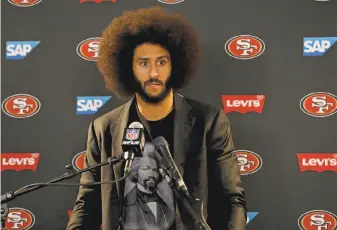  ?? Rick Scuteri / Associated Press 2016 ?? Former 49ers quarterbac­k Colin Kaepernick, still looking for work after his season of national-anthem protests, has donated about 50 suits to help parolees on job interviews.