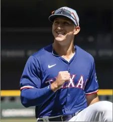  ?? JEFFREY MCWHORTER — THE ASSOCIATED PRESS ?? Texas Rangers rookie Wyatt Langford warms up before a spring training game against the Boston Red Sox on Tuesday, March 26, 2024, in Arlington, Texas.