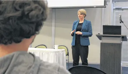  ?? COLIN MACLEAN/JOURNAL PIONEER ?? Dunsky Energy Consulting senior consultant Julie-Ann Vincent speaks with members of the public during a recent informatio­n session on Summerside’s Capacity Resource Plan.