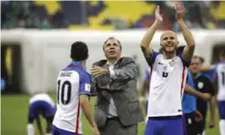  ?? — AP ?? MEXICO CITY: United States coach Bruce Arena, center, celebrate with Christian Pulisic, left, as Michael Bradley salutes supporters at the end of a World Cup soccer qualifying match at the Azteca Stadium in Mexico City, Sunday.