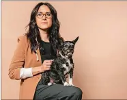  ?? DANIA MAXWELL/LOS ANGELES TIMES ?? Sydney Freeland, director and executive producer of Marvel’s “Echo” poses for a portrait with the dog she named Echo.