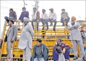  ?? ANI ?? Farmers during their ongoing protest against the three farm laws, at Ghazipur border in New Delhi on Monday
