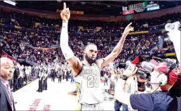  ?? DAVID LIAM KYLE/NBAE/GETTY IMAGES/AFP ?? LeBron James of the Cleveland Cavaliers celebrates their victory over the Minnesota Timberwolv­es on Wednesday at Quicken Loans Arena in Cleveland, Ohio.
