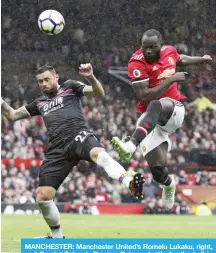  ?? for the ball in the English Premier League soccer match. — AP ?? MANCHESTER: Manchester United’s Romelu Lukaku, right, and Crystal Palace’s Damien Delaney battle