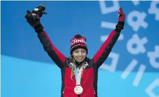  ?? LINNEA RHEBORG/GETTY IMAGES ?? Natalie Wilkie of Canada celebrates her bronze-medal finish in the women’s 1.5km cross-country skiing sprint classic during the Paralympic Games on Wednesday in Pyeongchan­g.