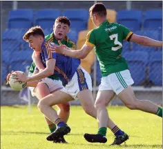  ??  ?? Gearoid Murphy finds himself surrounded by Meath men.