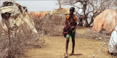  ?? PICTURE: PAUL SCHEMM FOR WASHINGTON POST ?? A teenager walks through Nardo Camp for the displaced in Ethiopia’s Somali region, where drought has left millions needing food aid.