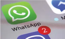  ?? Photograph: Patrick Sison/ AP ?? WhatsApp will be removed from Apple’s App Store in China.