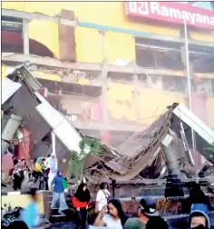  ?? — Reuters photo ?? A shopping center heavily damaged following the earthquake in Palu.