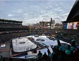  ?? ALIKA JENNER/GETTY IMAGES ?? Fans at T-Mobile Park in Seattle celebrated as the Kraken dominated the Golden Knights, 3-0, in the Winter Classic.