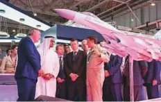 ?? WAM ?? Shaikh Mohammad Bin Zayed and Dmitry Rogozin, Deputy Prime Minister of Russia (left), view an aircraft model.
