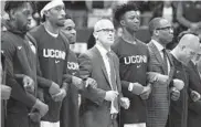  ?? JESSICA HILL/ASSOCIATED PRESS ?? Connecticu­t coach Dan Hurley, center, willl be returning to his home state of New Jersey for today’s game.