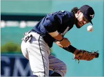  ?? ALEX BRANDON / ASSOCIATED PRESS ?? Braves shortstop Dansby Swanson bobbles a ball in the eighth inning of the Washington Nationals’ 10-5 victory on July 9. At the plate, Swanson is hitting .220 in 88 games.
