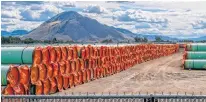  ?? REUTERS ?? Steel pipe to be used in the oil pipeline constructi­on of the Canadian government’s Trans Mountain Expansion Project lies at a stockpile site in Kamloops, B.C. on June 18, 2019.