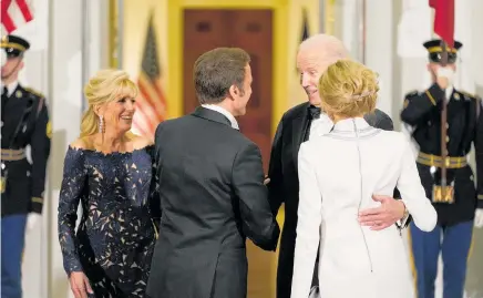  ?? Photo / AP ?? Joe Biden and first lady Jill Biden are all smiles as Emmanuel Macron and his wife Brigitte Macron arrive at a State Dinner in Washington.