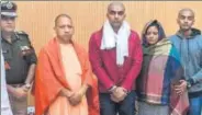  ?? PTI ?? UP chief minister Yogi Adityanath with the family of Subodh Kumar Singh, the police inspector killed in the Bulandshah­r violence.