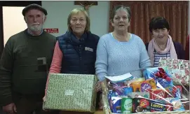  ??  ?? Noirin Brennan (2nd left), President of the St Vincent de Paul Mallow Conference, preparing festive hampers with fellow members Donal Dulohery, Marion Cremin and Sheila Crowley.
