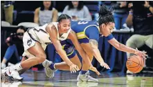  ??  ?? Connecticu­t's Aubrey Griffin, left, and Tulsa's Kayla Moutry (23) battle for the ball during Sunday's game in Storrs, Conn. [AP PHOTO/STEPHEN DUNN]