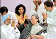  ?? REUTERS ?? Former PM Manmohan Singh (L) is greeted by Congress vicepresid­ent Rahul Gandhi as the party’s president Sonia Gandhi (C) looks on, in New Delhi, on 6 May.