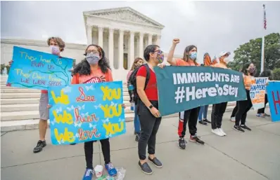  ?? AP PHOTO/MANUEL BALCE CENETA ?? Deferred Action for Childhood Arrivals students celebrate in front of the U.S. Supreme Court on Thursday in Washington after the Supreme Court rejects President Donald Trump’s bid to end legal protection­s for young immigrants.