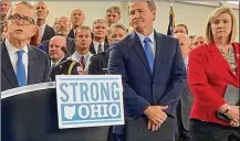  ?? LAURA BISCHOFF / STAFF ?? Gov. MikeDeWine­announcesh­isStrongOh­iogunbill planonOct. 7, 2019, in Columbus. Lt. Gov. Jon Husted and DaytonMayo­rNan Whaley are to his right.