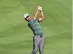  ??  ?? Xander Schauffele plays his third shot on the second hole Saturday during the thrid round at TPC Scottsdale.